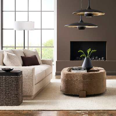 Small Condo Living Room with Contemporary Beige Sofa and Leather and Metal Oval Cocktail Table