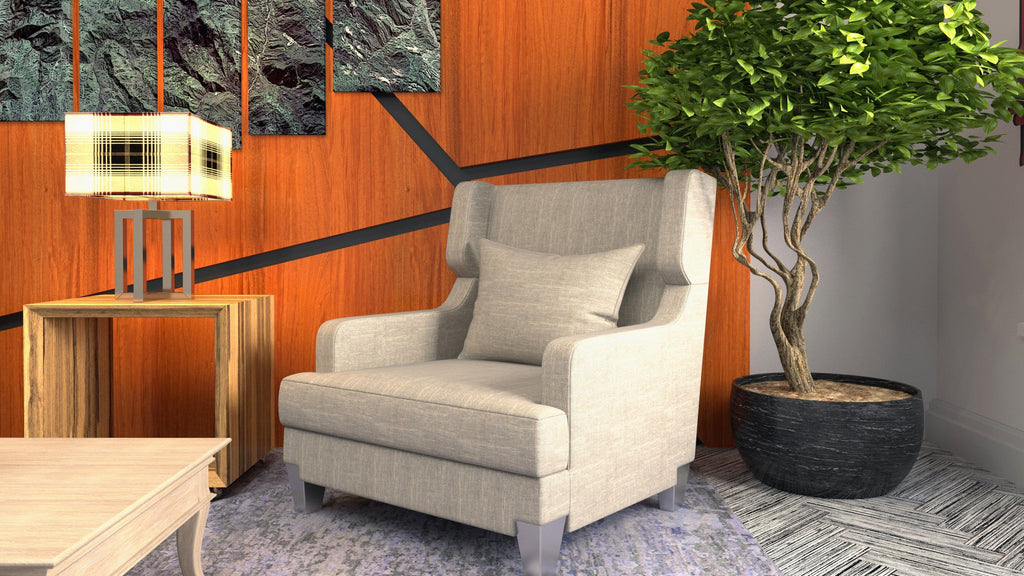 Cream upholstered wingback accent chair with a lumbar cushion, styled against a walnut wood panel wall with a large indoor tree.