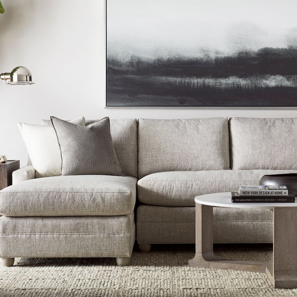 L shaped sectional sofa in natural linen woven fabric.