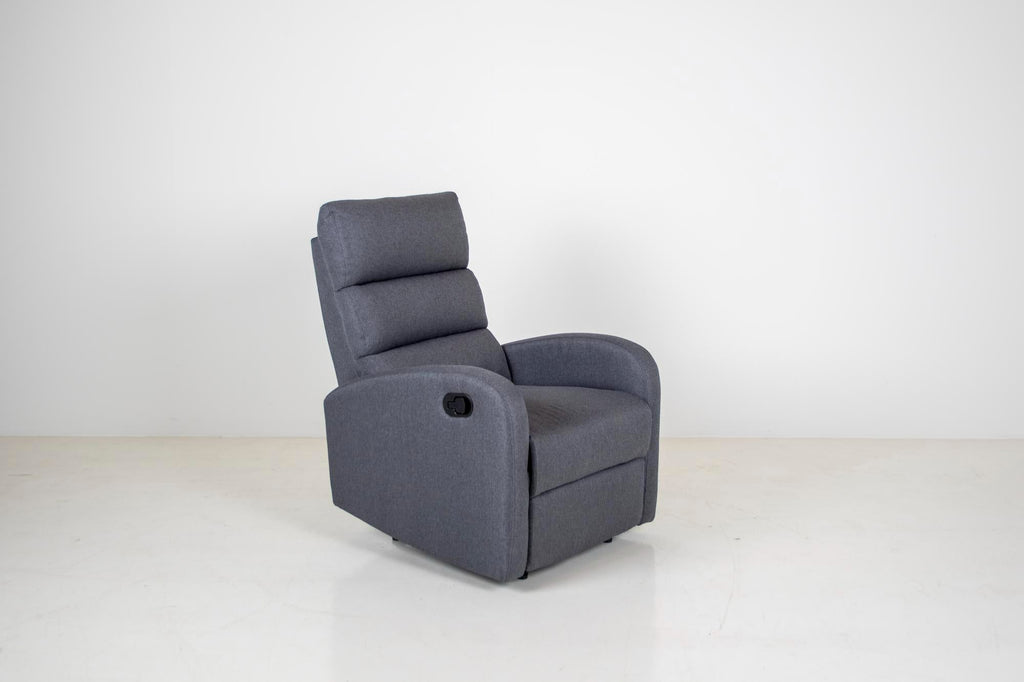 Charcoal grey fabric manual recliner chair with a push-button side handle, padded segmented back, and wide cushioned armrests on a white background.