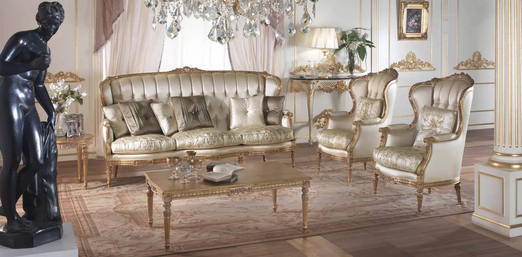 Italian baroque living room set with gold-leaf carved sofa, silk upholstered wingback chairs, gilded coffee table, and crystal chandelier