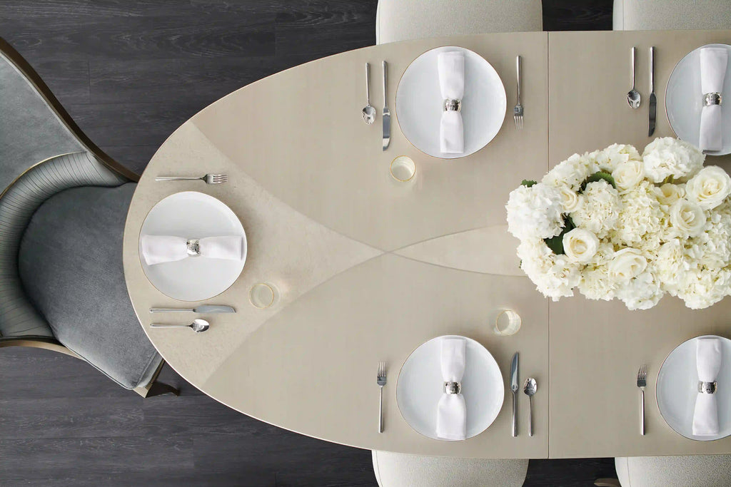 Close detail of a Mobilart dining tabletop surface, shown for material texture across table shape options. 