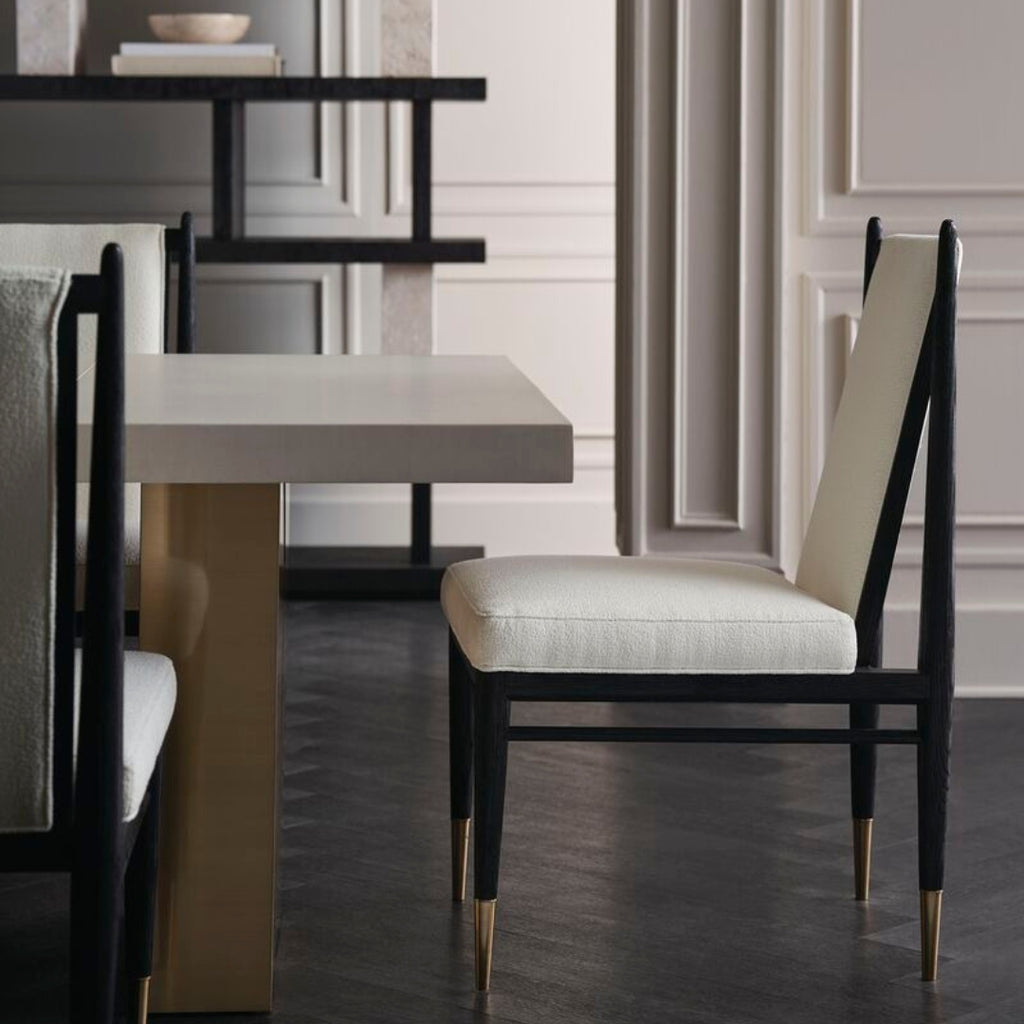 Dining room with modern chairs and tables in a stylish interior setting.