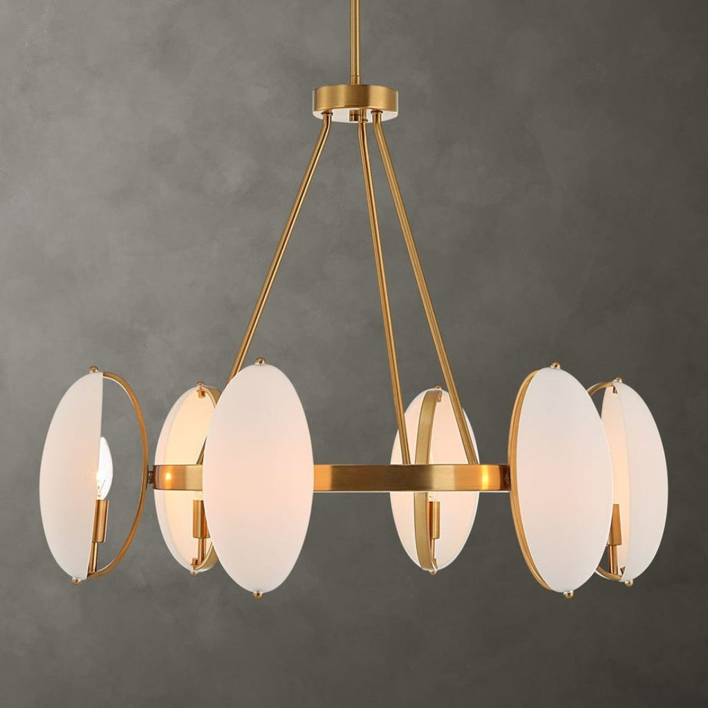 Gold chandelier with white glass shades on a gray background