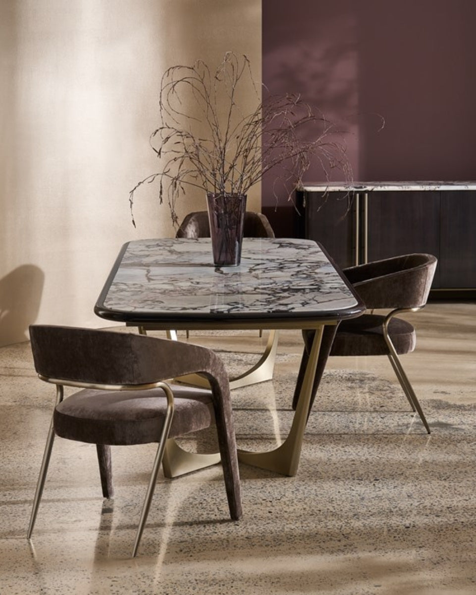 Dining room with a marble table and modern chairs in a stylish interior.