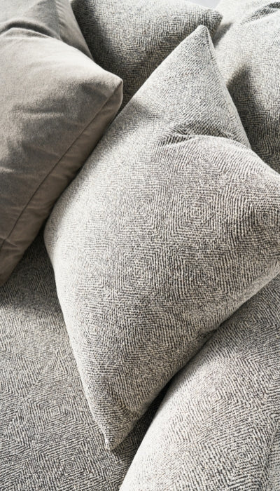 Close-up of textured gray cushions on a sofa