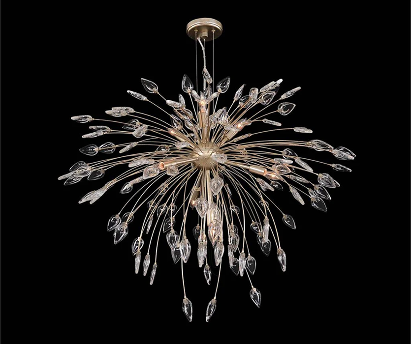 Starburst chandelier with thin gold branches radiating outward and small glowing bulbs, shown in a studio against a dark background