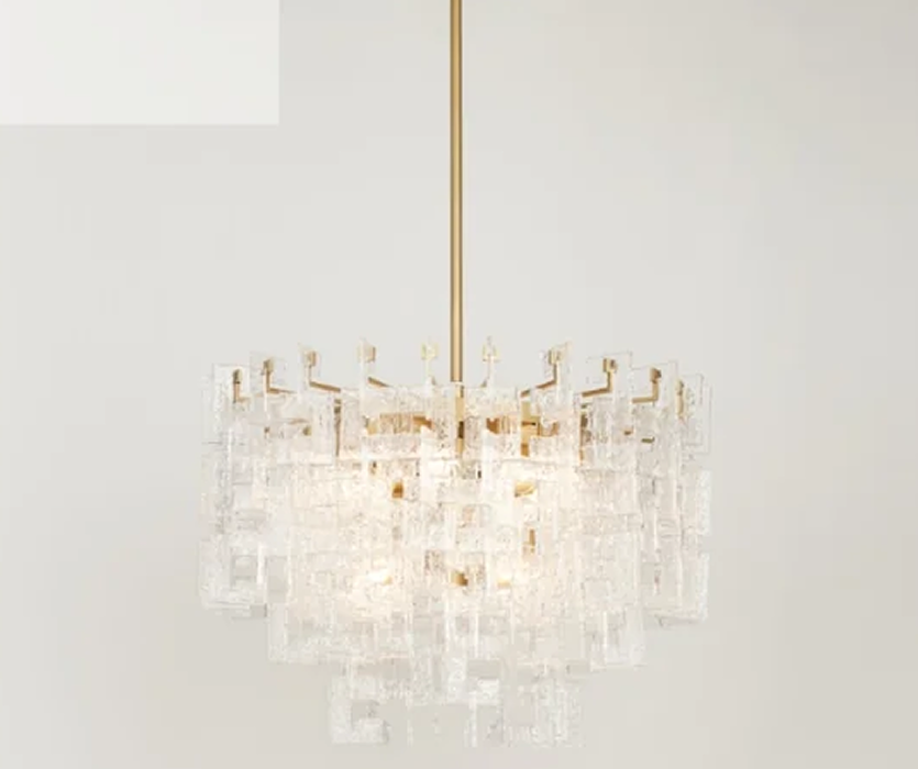 Crystal chandelier with a gold-toned frame and clustered rectangular glass pieces, photographed against a clean white background