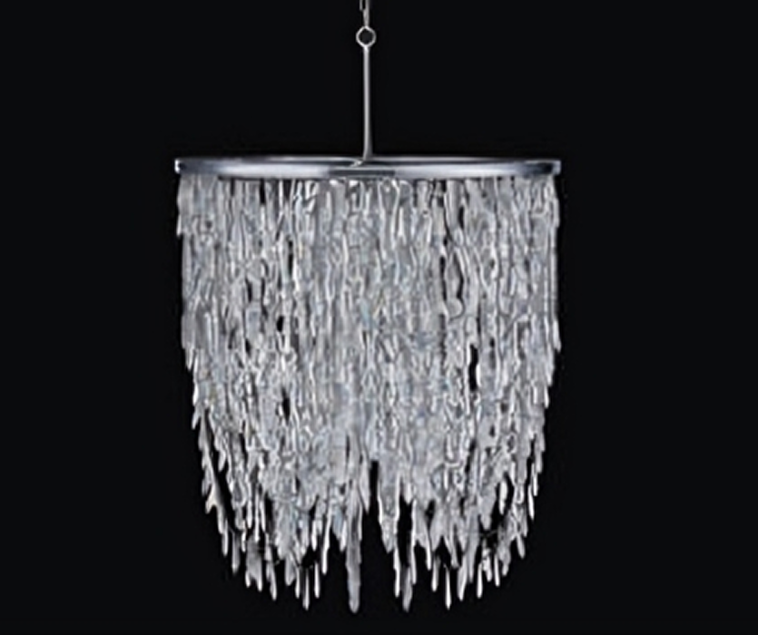 A round crystal pendant light with long cascading glass strands on a polished chrome frame