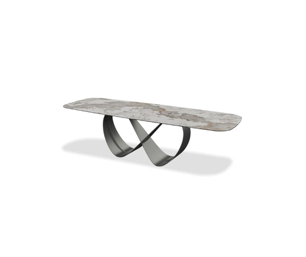 Rectangular stone-top console table with a textured natural finish and sculptural intersecting metal base in a modern, minimalist design.